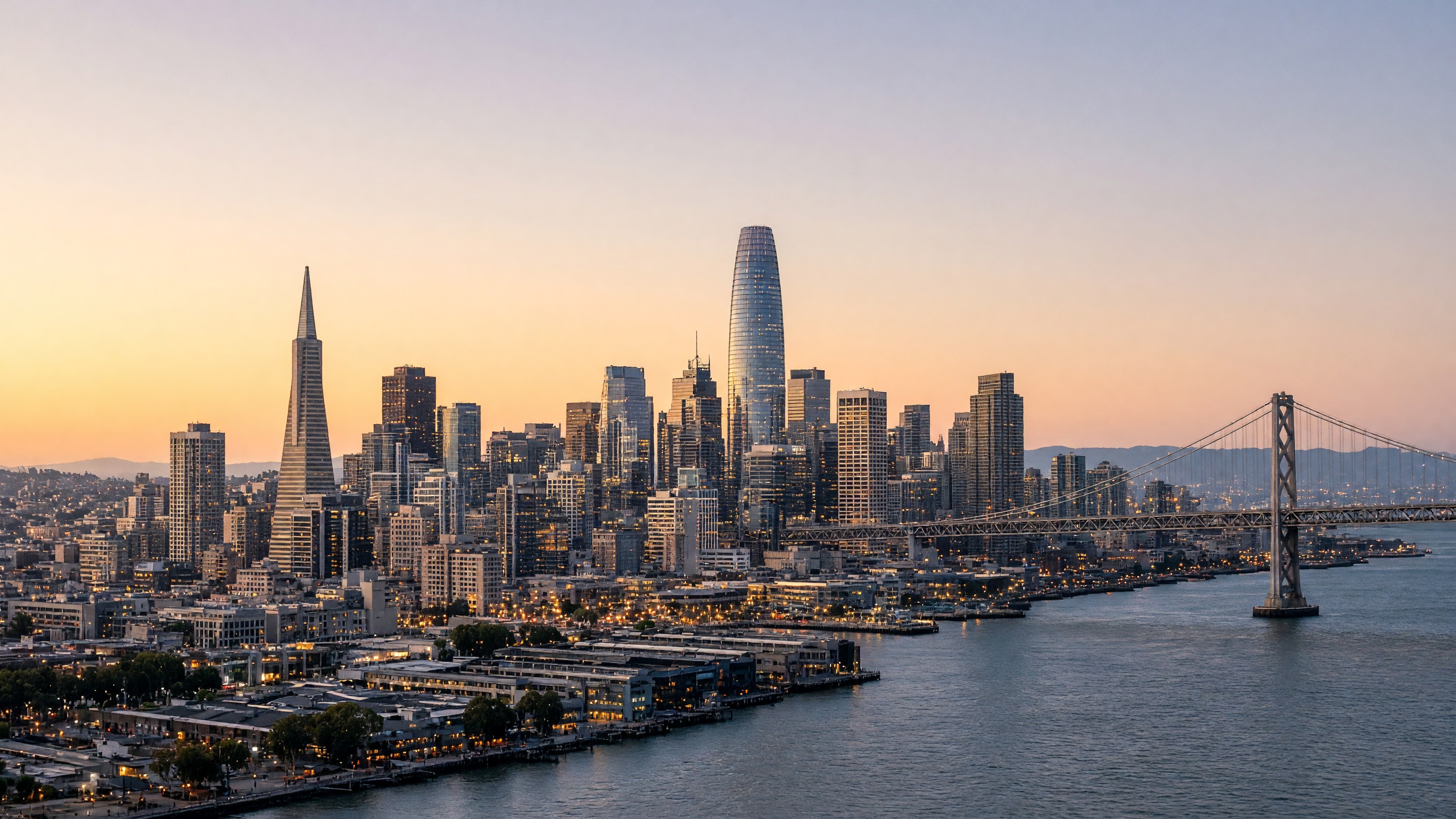 San Francisco skyline at dusk, with Transamerica Pyramid, Salesforce Tower, San Francisco–Oakland Bay Bridge