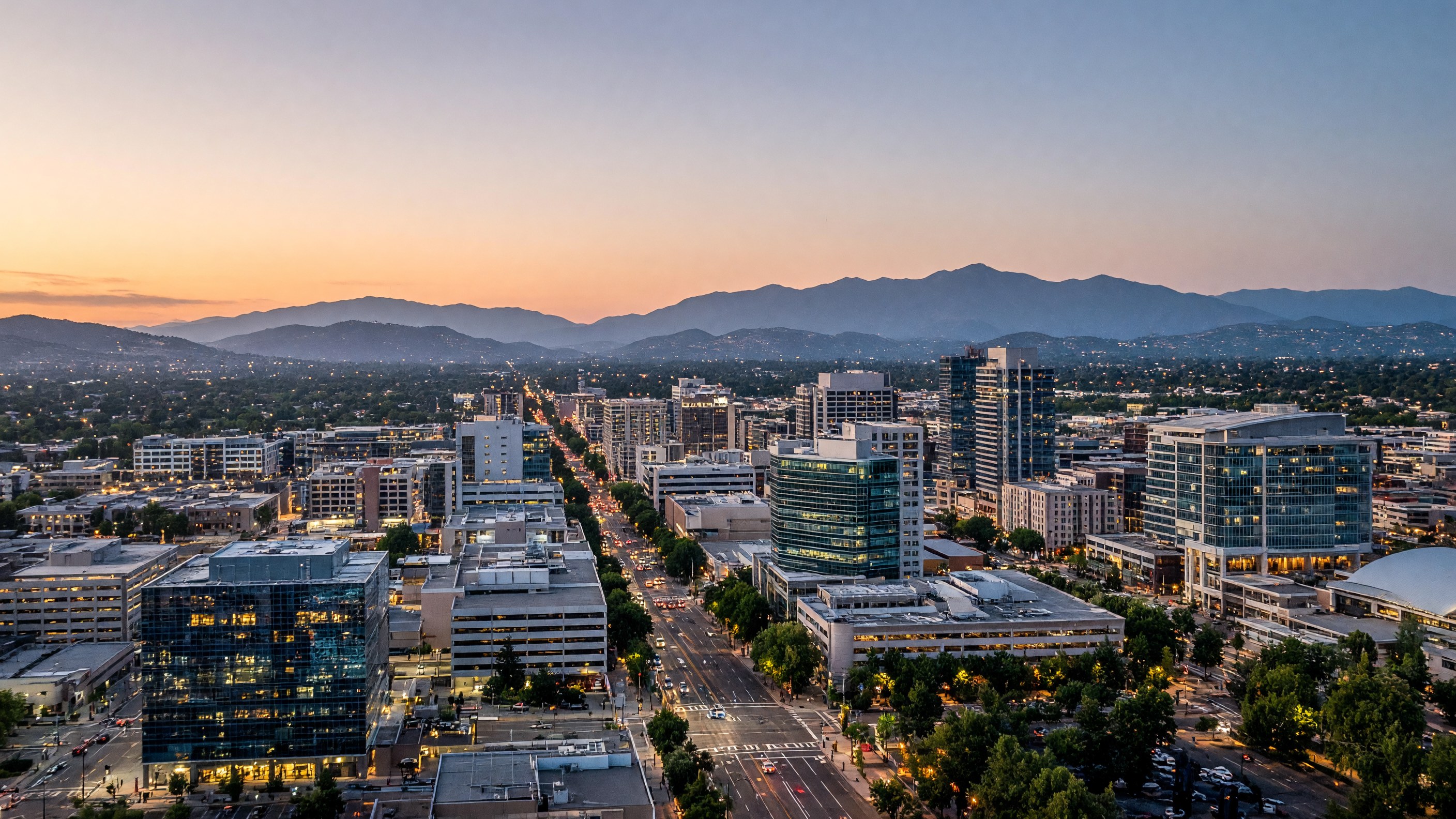 San Jose skyline at dusk, with downtown San Jose, Mount Hamilton in the distance
