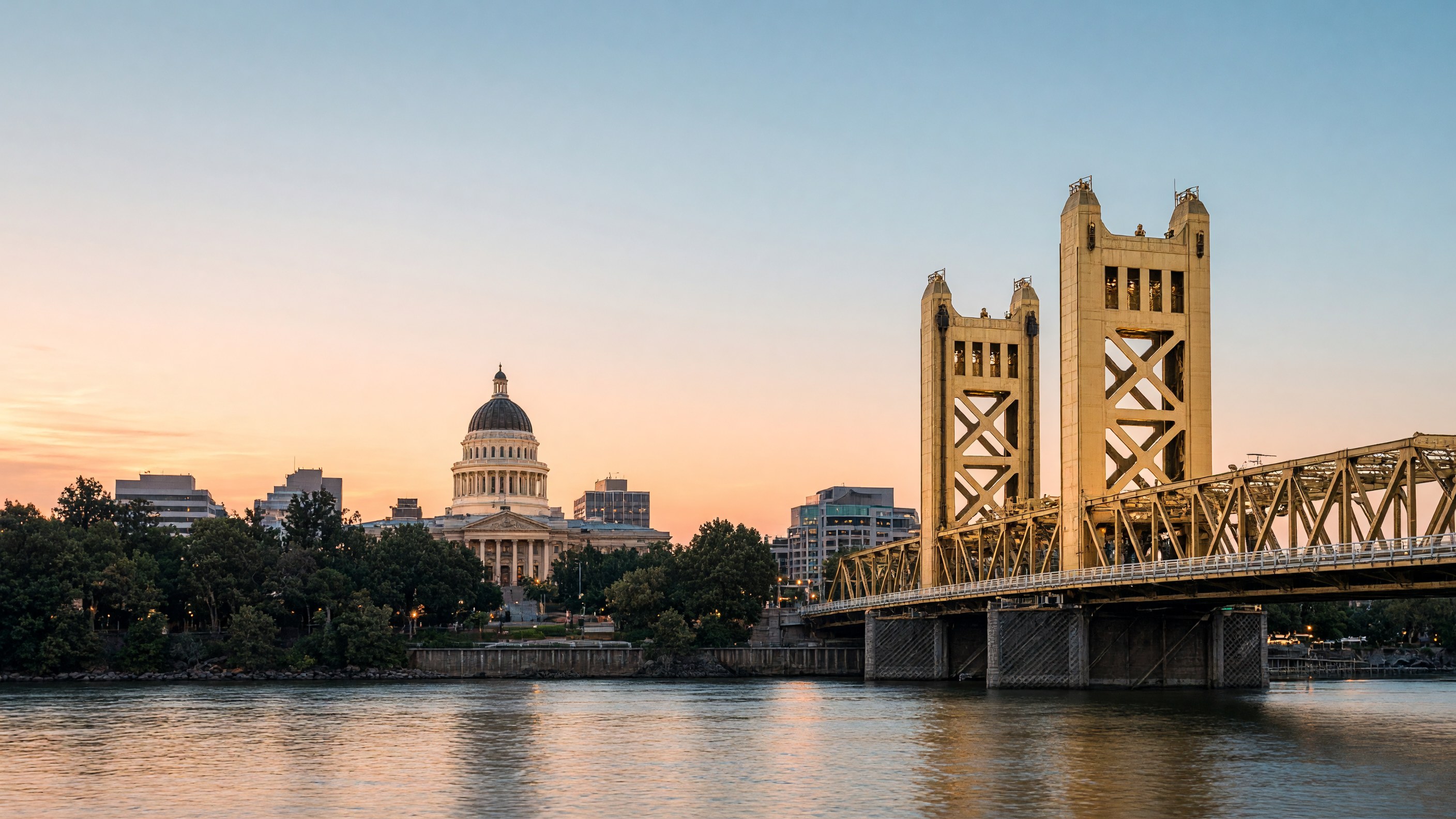 Sacramento skyline at dusk, with California State Capitol, Tower Bridge