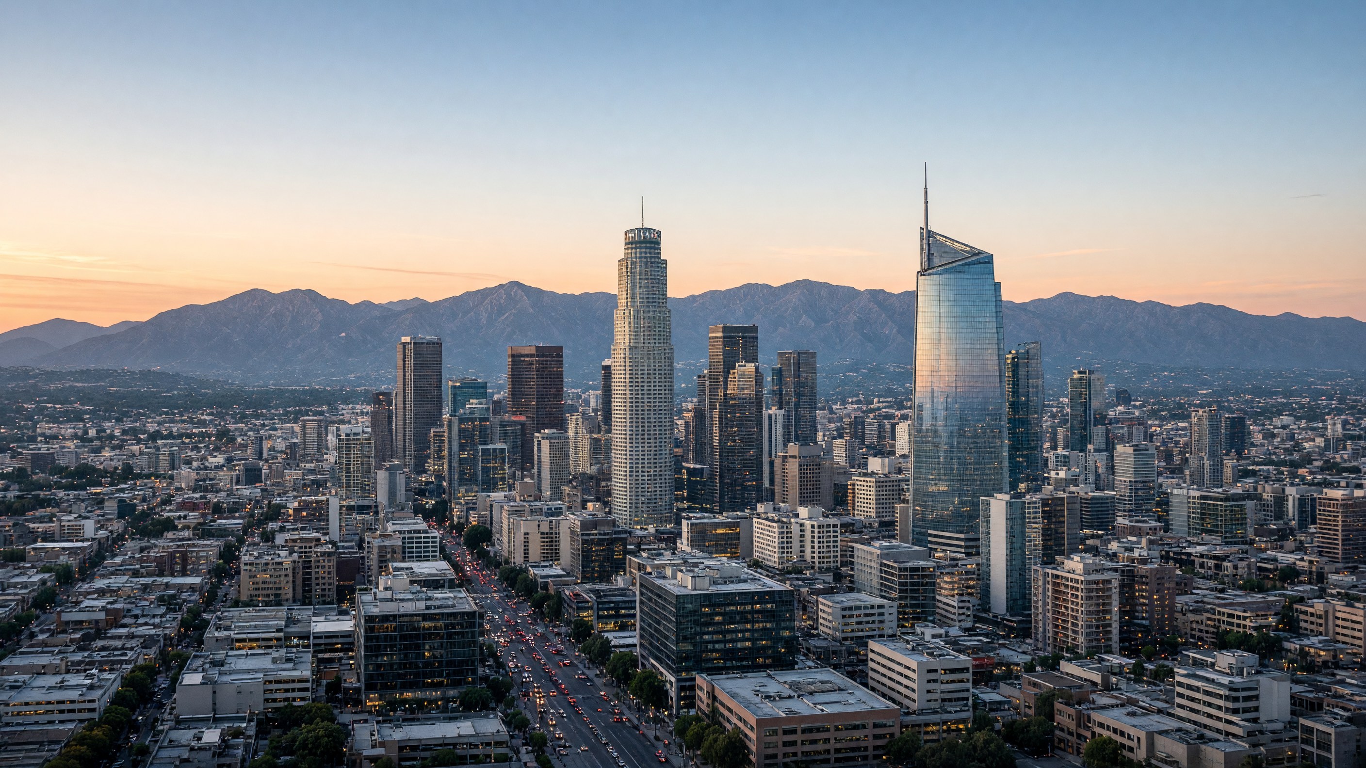 Los Angeles skyline at dusk, with U.S. Bank Tower, Wilshire Grand Center, San Gabriel Mountains