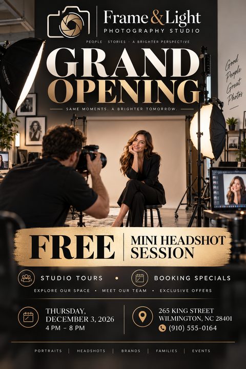 A photography studio grand opening flyer with a black background and gold accents. A large photo shows a photographer shooting a female model. Text offers a free mini headshot session.